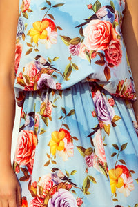 191-5 Long dress tied at the neck - flowers on a blue background